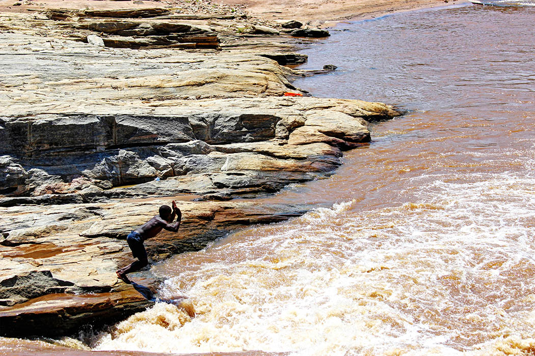 Sights & People from the North Rift_Boy jumping into river