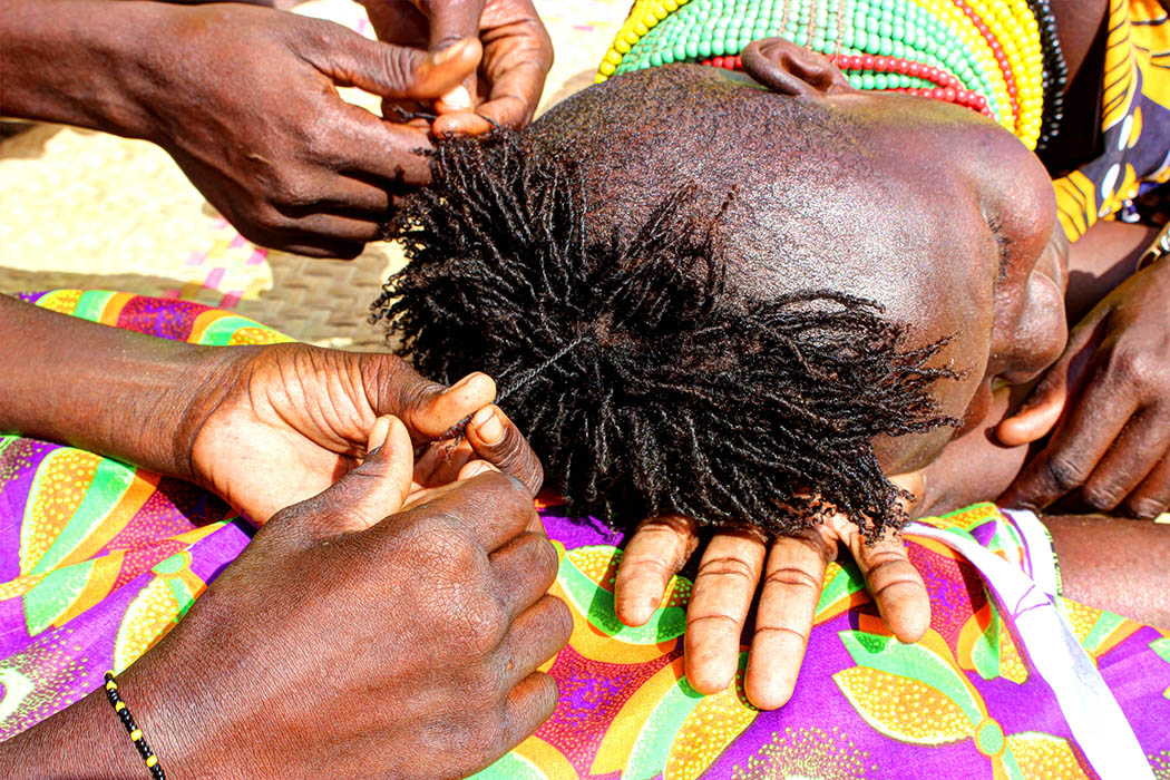 Sights & People from the North Rift_Turkana girl getting hair done